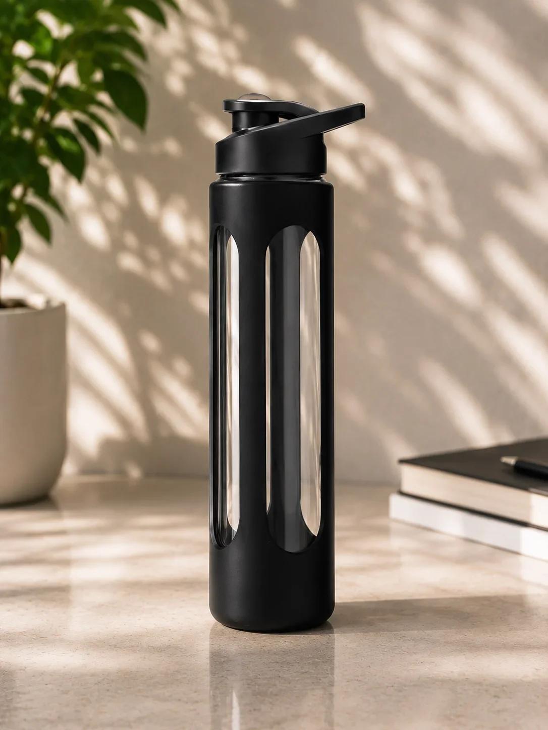 Clear Glass Water Bottle with Cut-Out Black Silicone Sleeve & Flip-Spout Lid